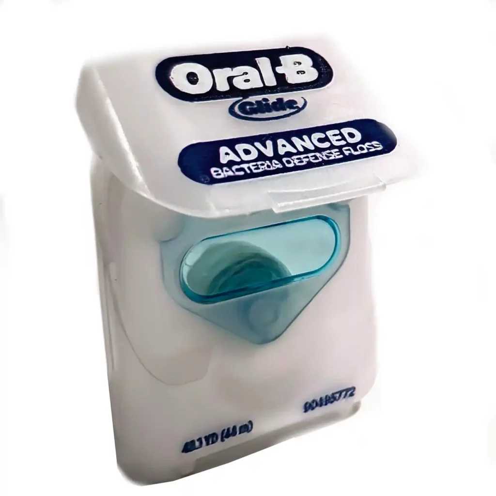 dental floss on a white background - oral b